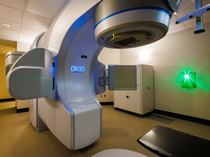 Angled view of the Varian Edge Radiosurgery System in a diagnostics room.